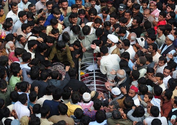 A funeral for victims of a suicide bombing targeting Sufi Muslims in Pakistan in February.